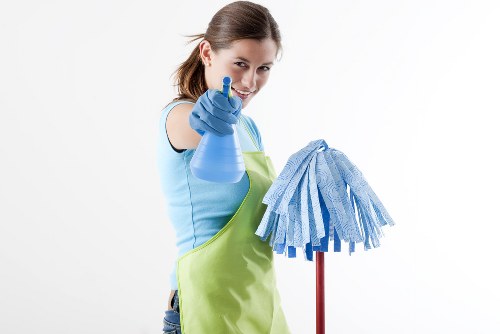 Cleaner sorting recyclable waste during a deep cleaning service in Edgware