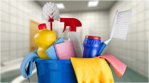 Cleaner carrying out a safe deep cleaning task with protective equipment